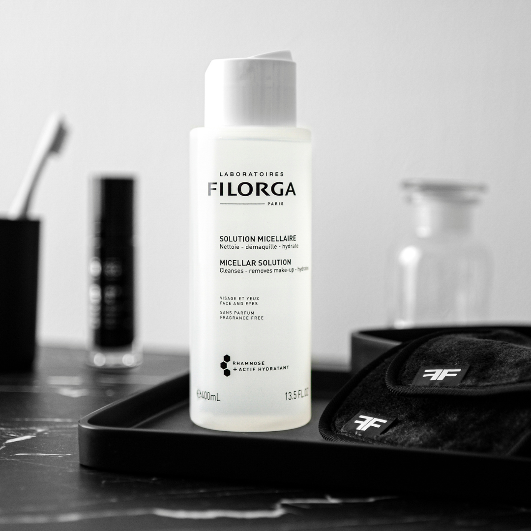 Filorga Micellar Water Bottle on a marble bathroom counter