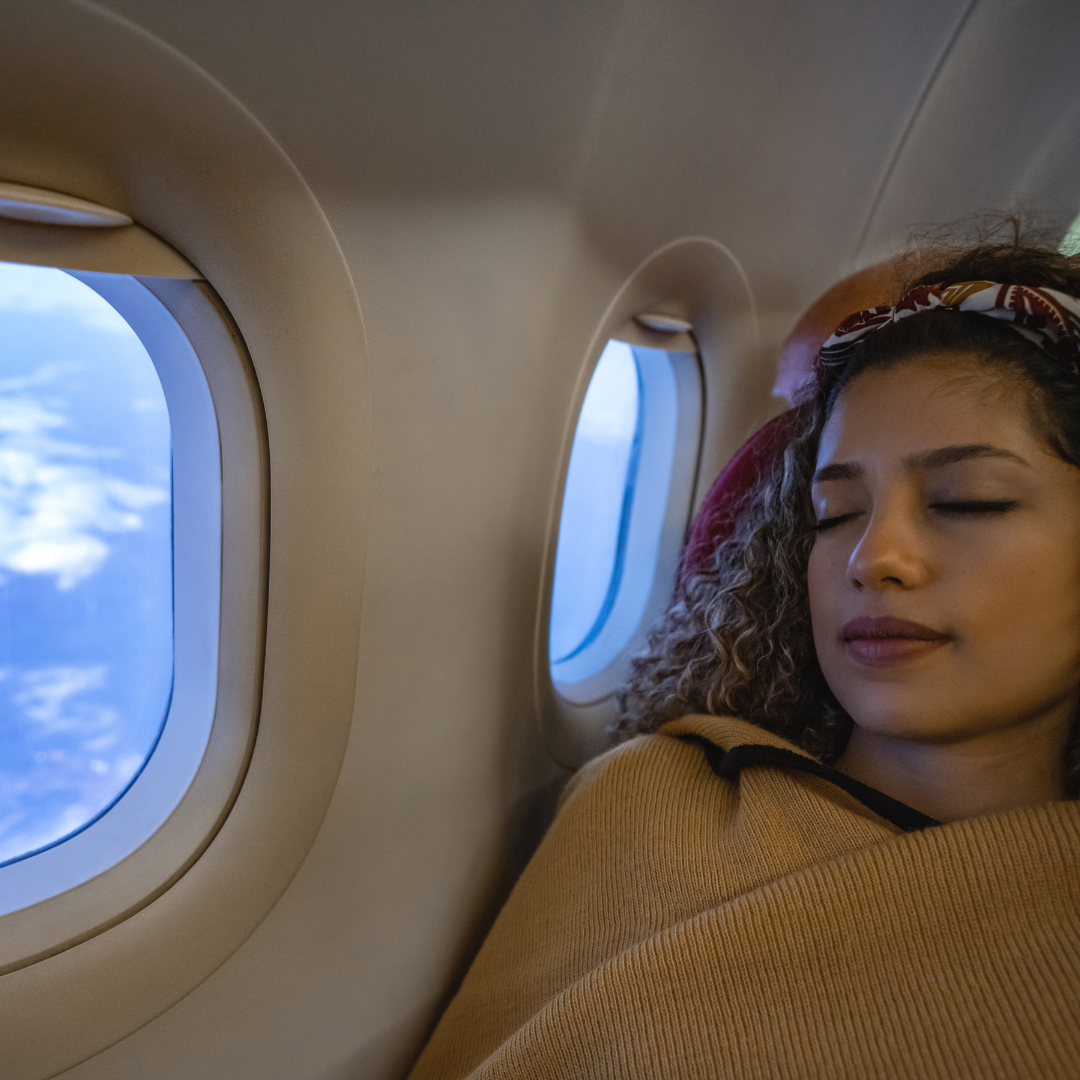 Woman asleep on airplane