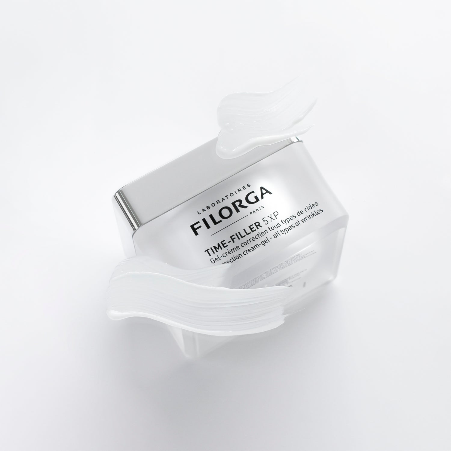 FILORGA TIME-FILLER 5-XP CREAM-GEL jar on white background facing up with cream-gel texture around it