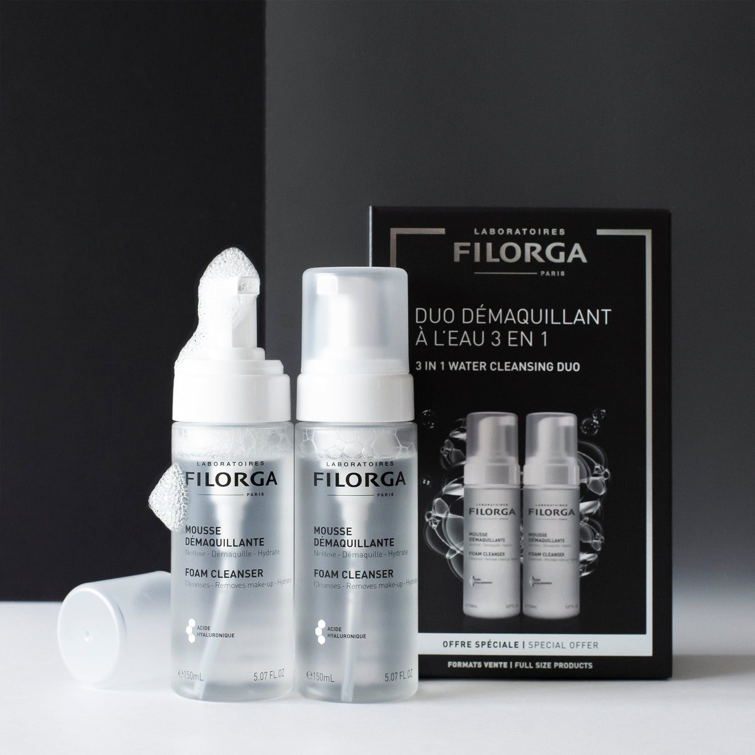 Open bottles of FILORGA FOAM CLEANSER DUO with box in the background