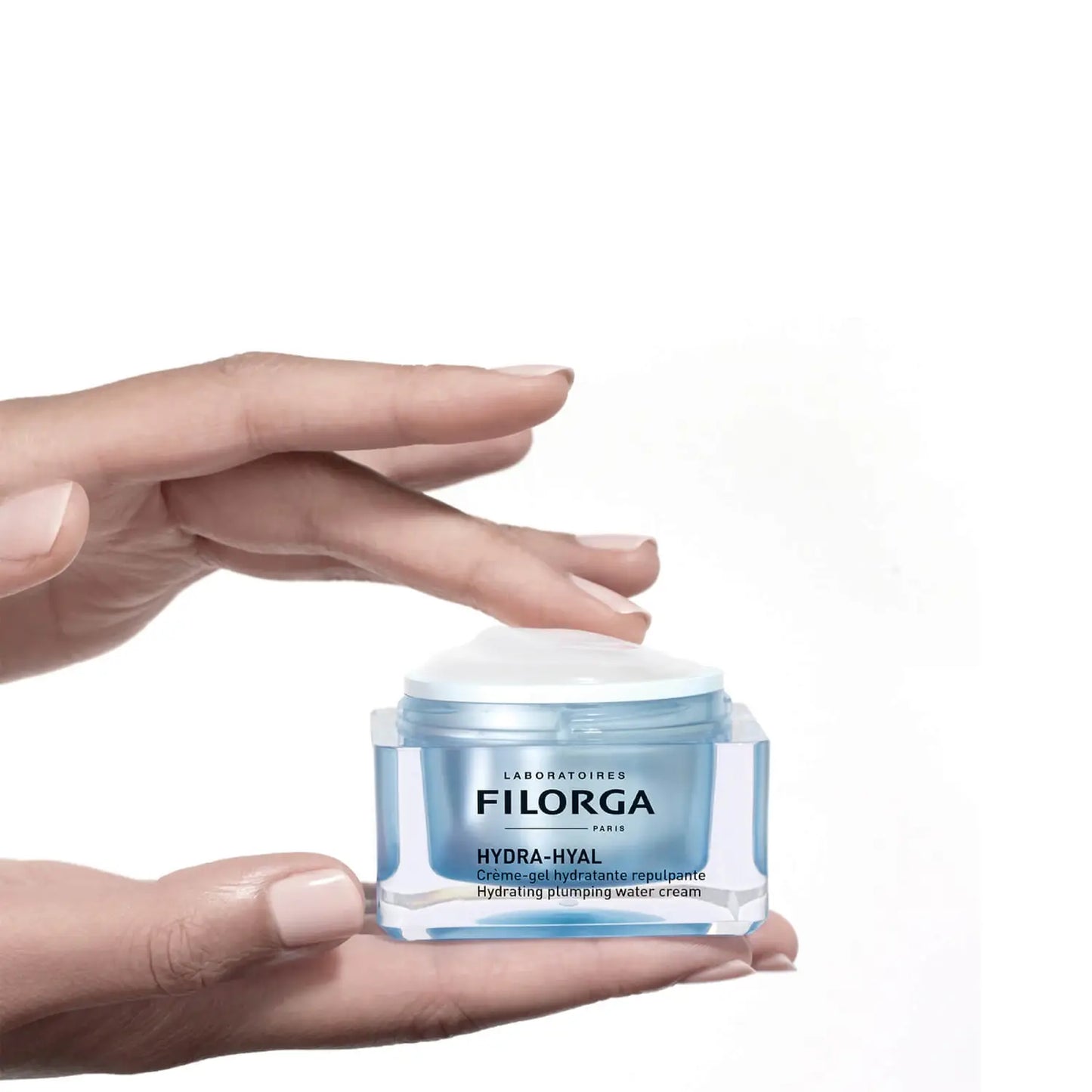Hands holding FILORGA HYDRA-HYAL CREAM-GEL open jar