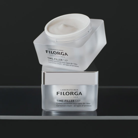 Two stacked jars of FILORGA TIME-FILLER 5-XP CREAM spinning 